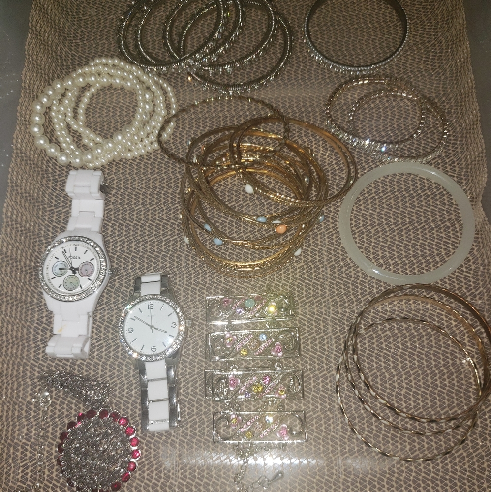 Bunch of bracelets watches and bangles